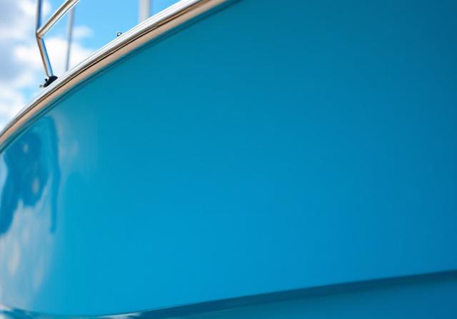 The same boat hull restored to a deep, glossy finish. 640x448